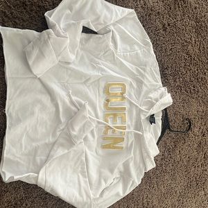 White crop top hoodie style shirt .